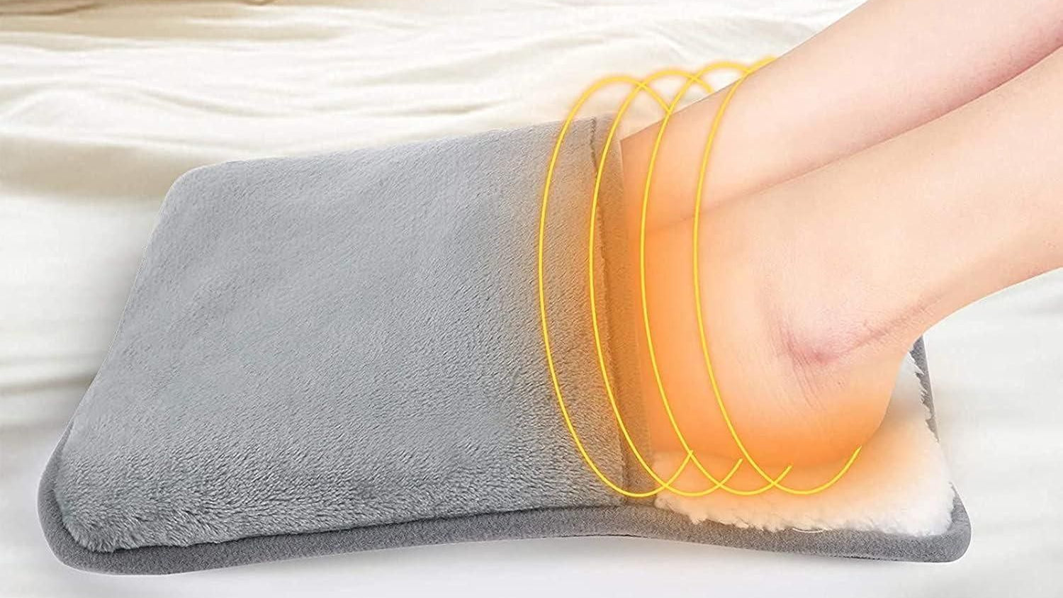 Constant temperature foot warmer pad being used on a foot with text indicating temperature range.